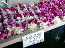 Leis made from Dendrobium flowers for sale in Kona