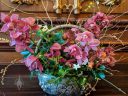 Cut flower arrangement with Cymbidium orchids in basket, Filoli Orchid Show, Filoli Historic House and Garden, Woodside, California