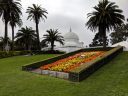 Flower clock and Conservatory of Flowers, palm trees, Victorian glasshouse, Golden Gate Park, San Francisco, California